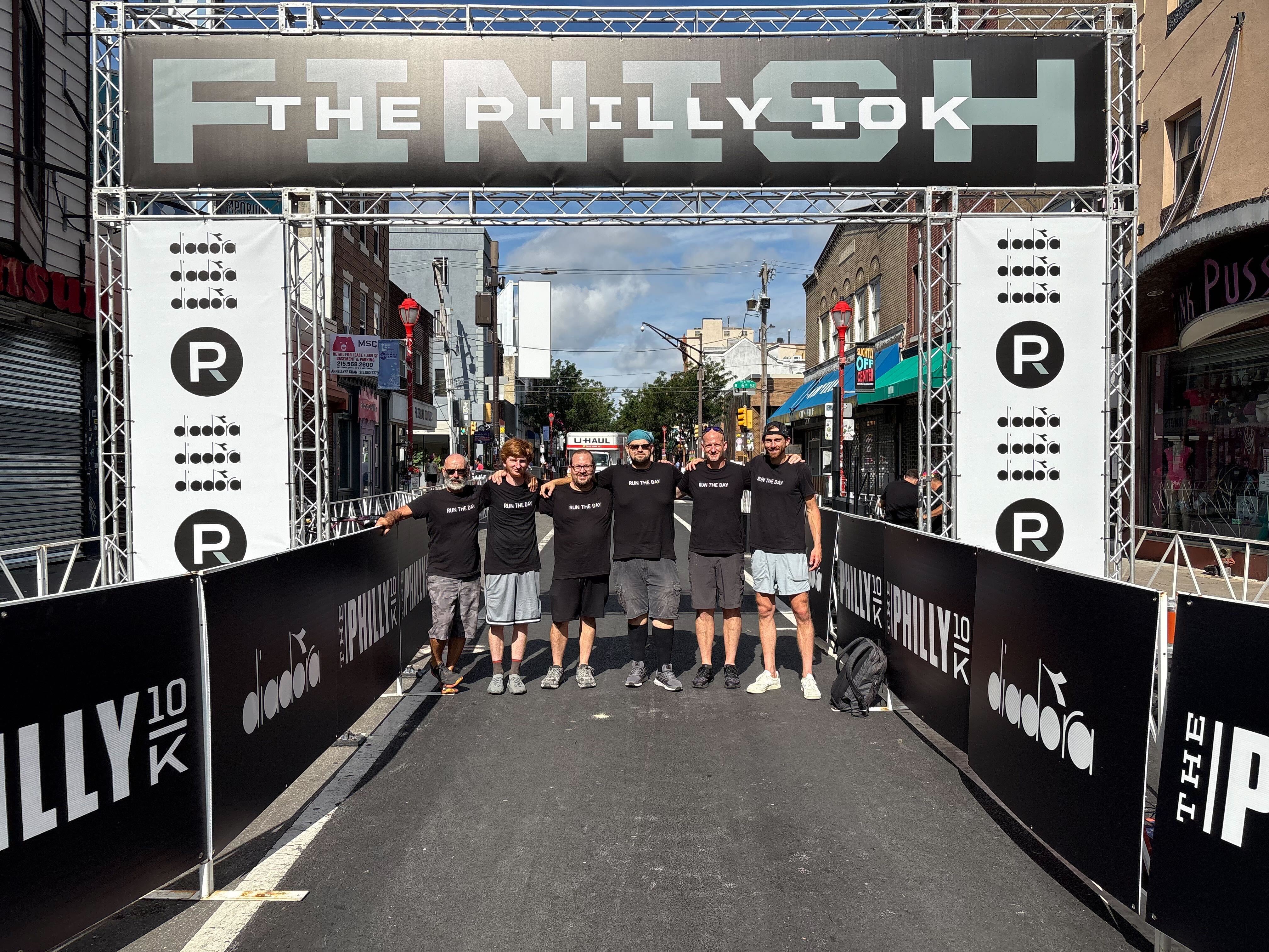 Run The Day team at The Philly 10K finish line — real race timing experts helping community events thrive for over 20 years